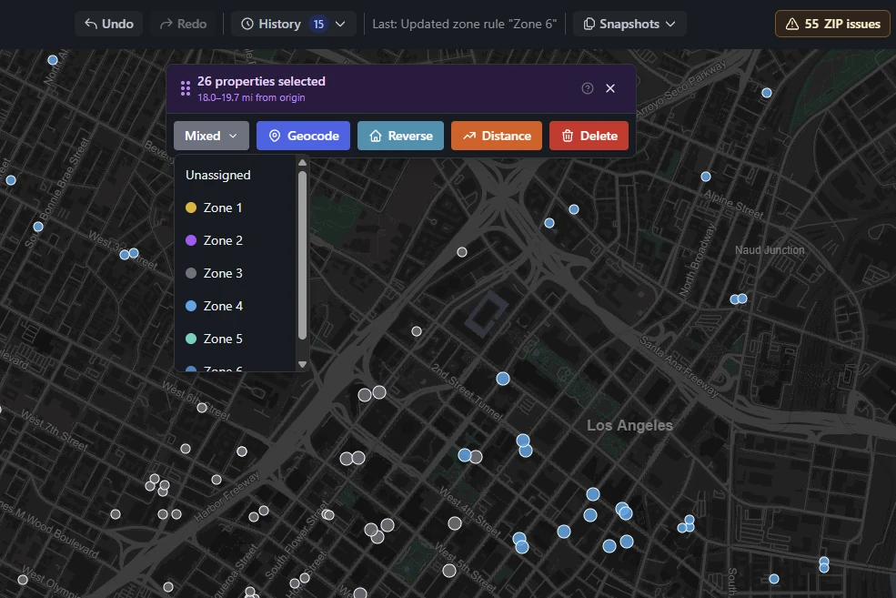 Twenty-six hotels selected on the map, with the zone list open beside Geocode, Reverse, Distance and Delete