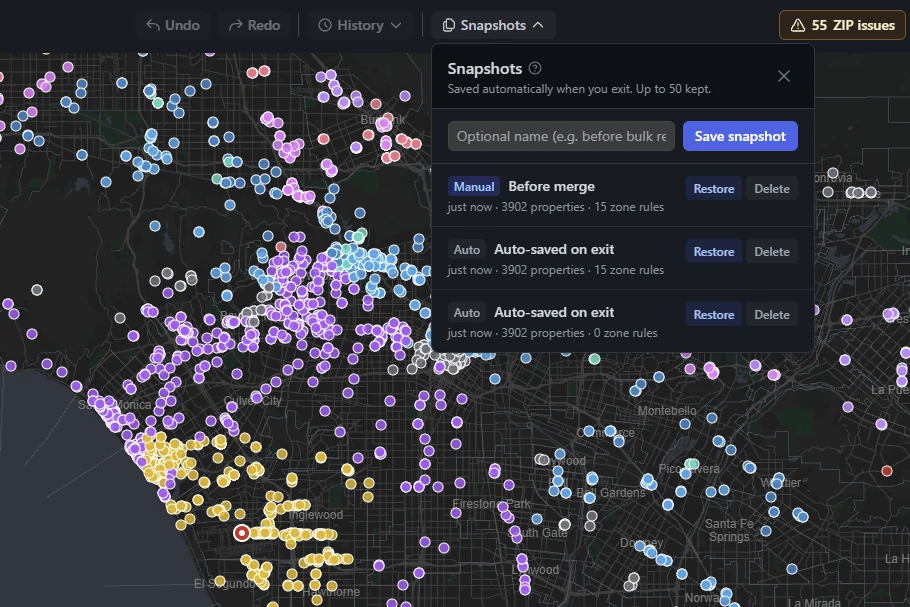 The Snapshots panel over a zoned Los Angeles map: one named checkpoint and two versions saved automatically on exit, each with Restore